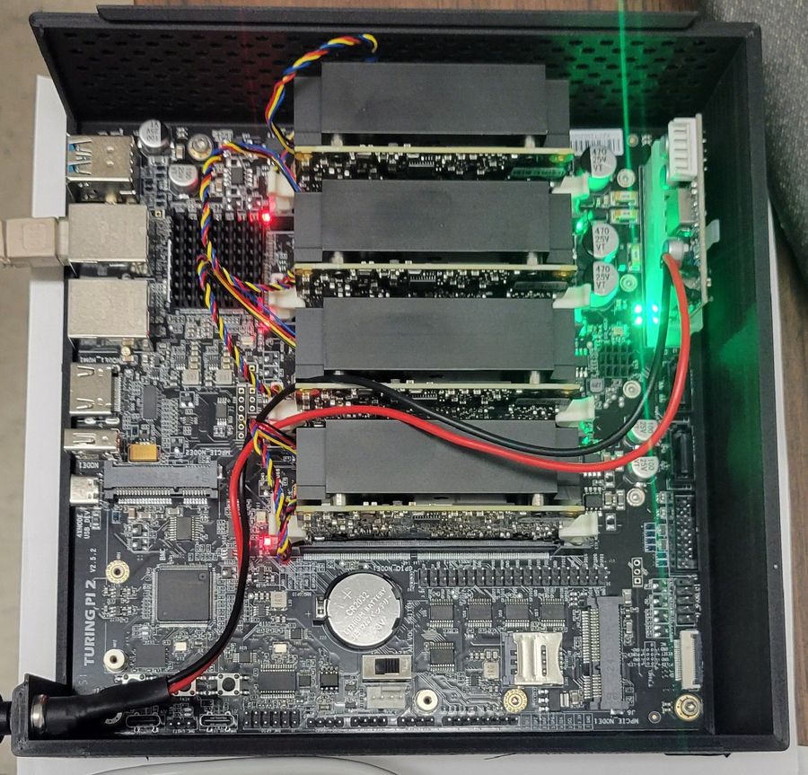 Turing Pi 2.5 cluster board populated with RISC-V compute modules, powered up