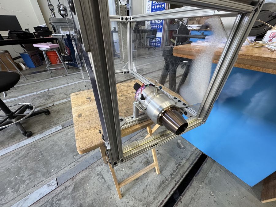 JetCat P60SE turbine engine mounted in a polycarbonate test enclosure on the lab bench